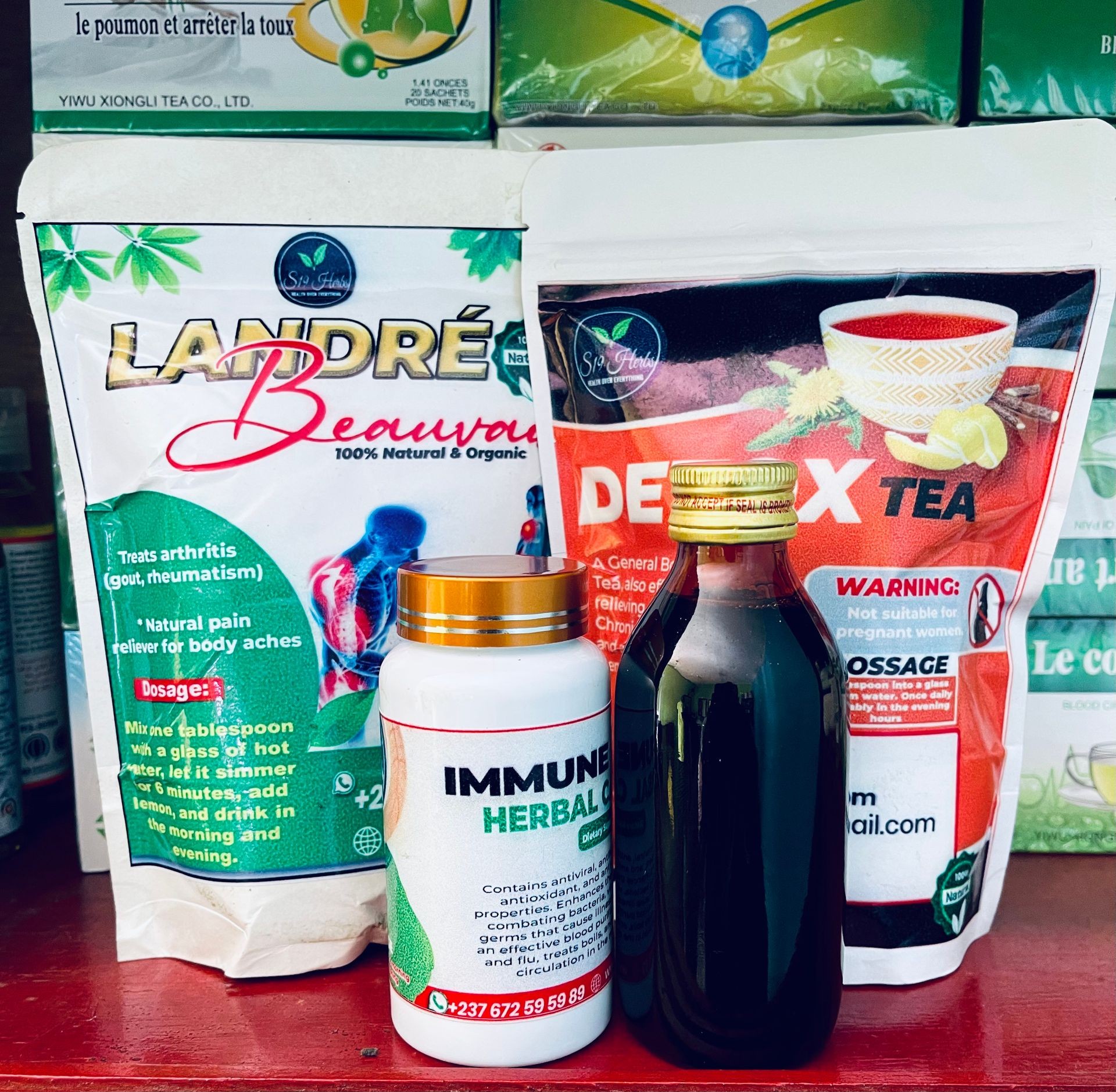 Herbal products including tea, capsules, and a bottled extract displayed on a shelf.